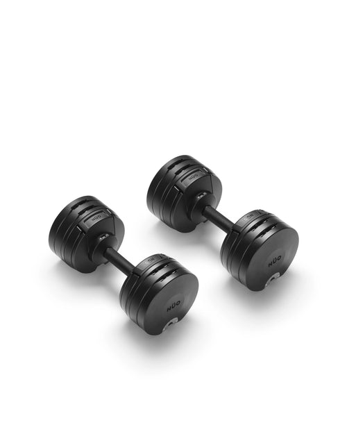 NÜOBELL S 560 Black adjustable dumbbell featuring a sleek matte finish, designed for efficient weight changes and powerful home strength training.