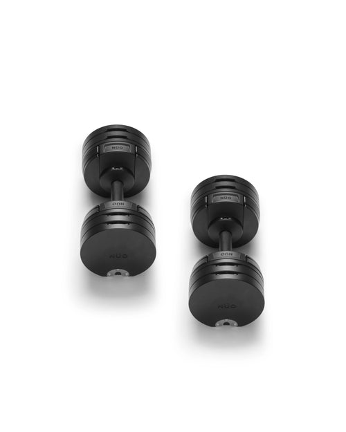 NÜOBELL S 560 Black adjustable dumbbell featuring a sleek matte finish, designed for efficient weight changes and powerful home strength training.