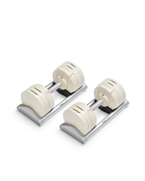 NÜOBELL S 560 Sand adjustable dumbbell in a stylish sand color, designed for home gyms, with advanced weight range and compact, space-saving construction.